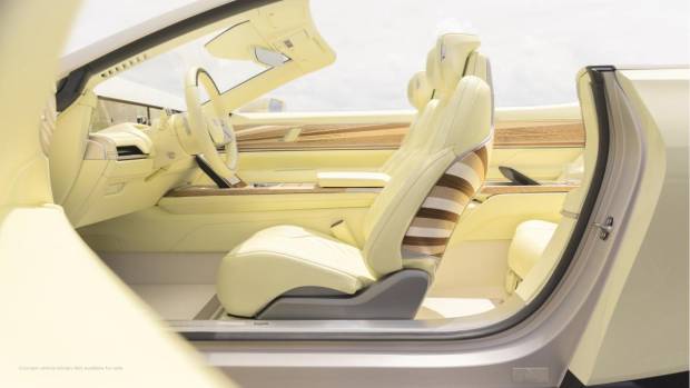 $!Side view of Cadillac SOLLEI concept vehicle interior in bespoke Sola Yellow Iridescent