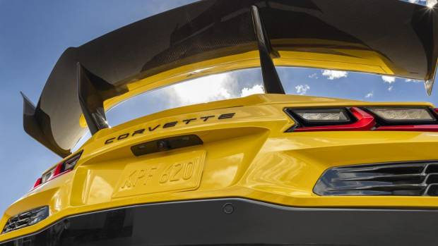 $!Rear view of Chevrolet Corvette ZR1 Coupe with ZTK Performance Package, looking up at the carbon fiber rear wing and blue sky. Preproduction model shown. Actual production model may vary.