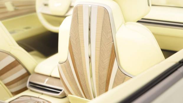 $!Close-up of Cadillac SOLLEI’s passenger side rear seating featuring Sunburst motif wood decor