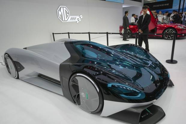 $!A staff member stands near at a MG concept car during an opening of China Auto Show in Beijing, China, Thursday, April 25, 2024. (AP Photo/Tatan Syuflana)